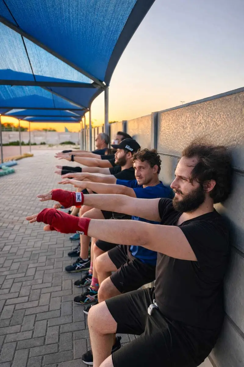 Members throwing punches in a line
